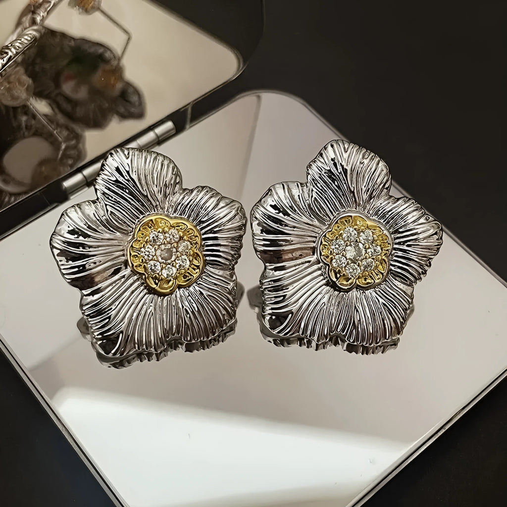 Retro textured two-tone copper stud earrings with gardenia petal motif on white background