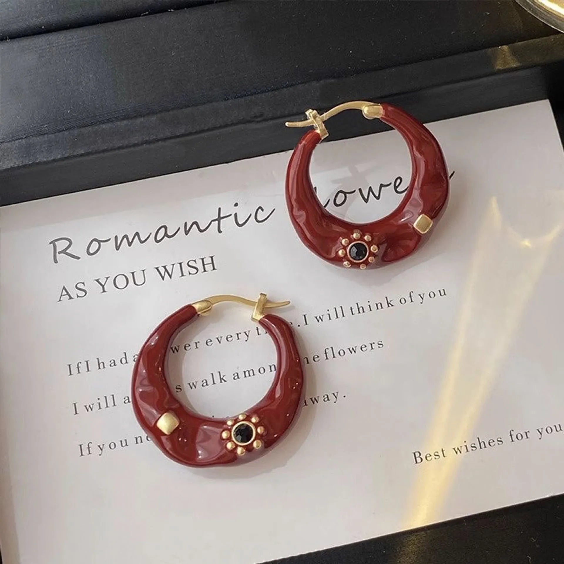 Hong Kong style retro ear studs with alloy construction and black rhinestone detailing