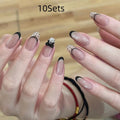 Press-on false nail kits showing multiple sets with assorted colours and adhesive tabs
