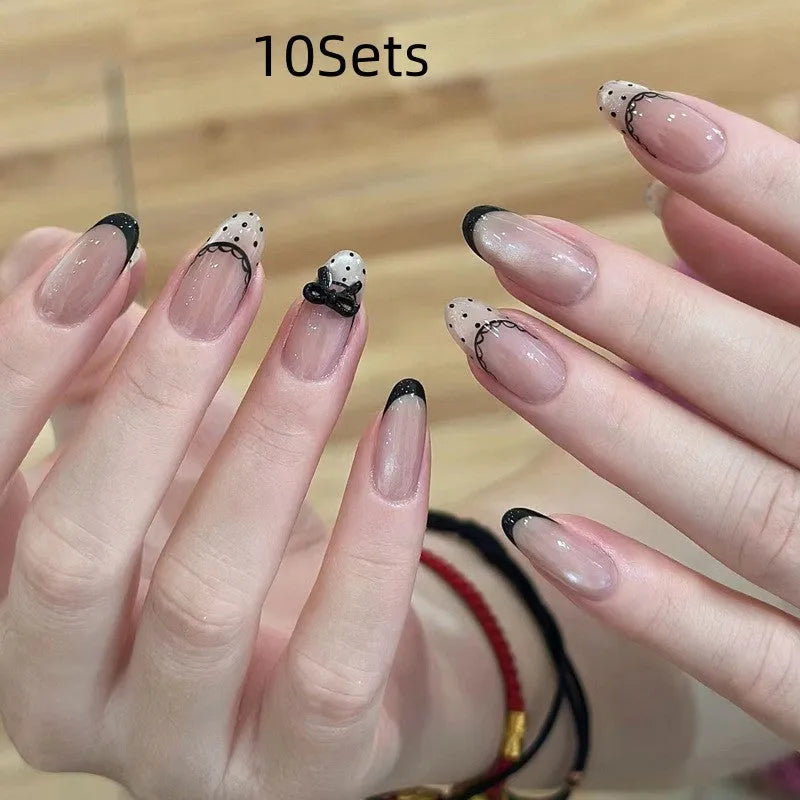 Press-on false nail kits showing multiple sets with assorted colours and adhesive tabs