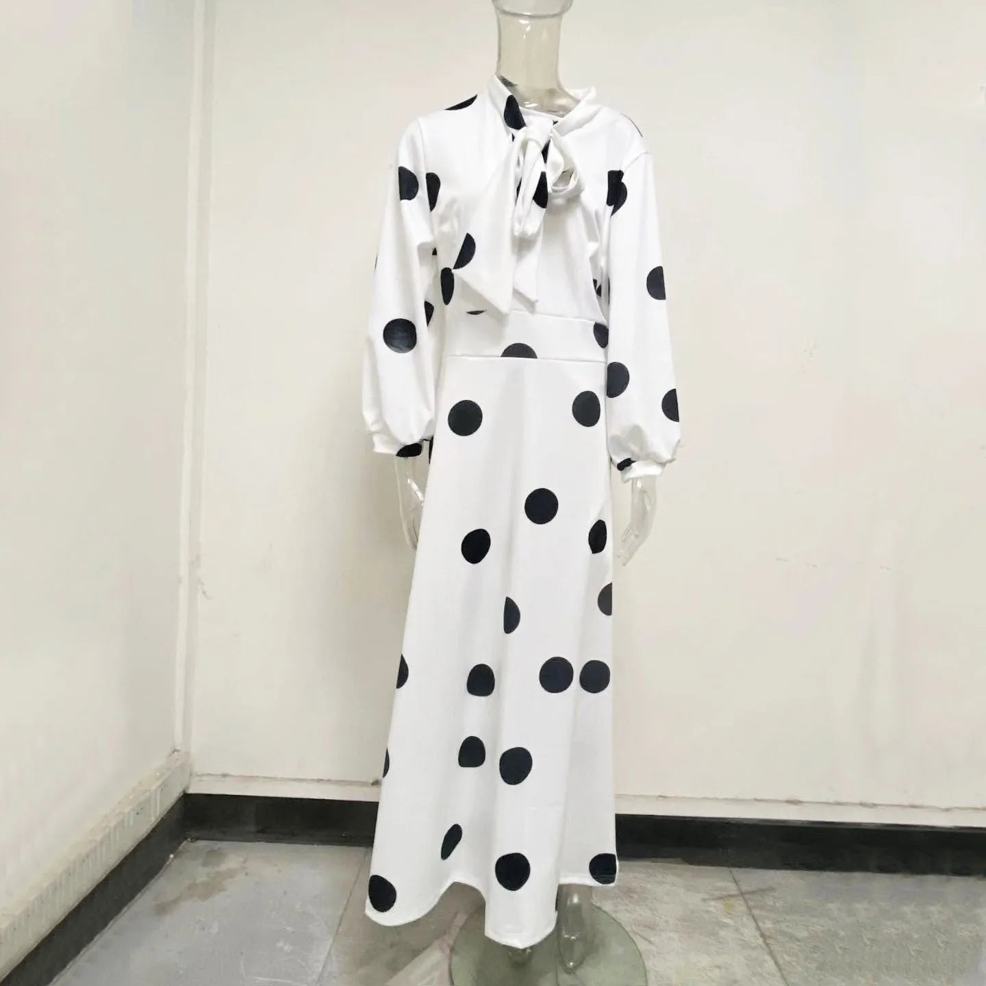 Women's large size white polka dot dress with long sleeves and long skirt, shown in white with white dots