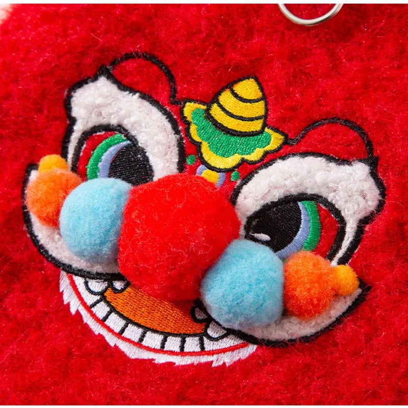 Red cotton-padded 3D lion dance pet vest with faux fur trim for small dogs and cats, featuring embellished eyes and pom-poms.
