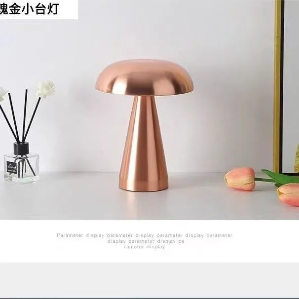 Mushroom-shaped ambient light in gold finish with European-style details on a bedside table