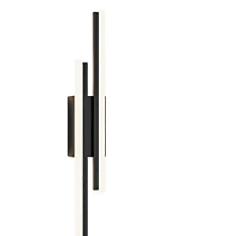 Minimalist Scandinavian LED wall light with black metal arm and white acrylic shade mounted on a wall.