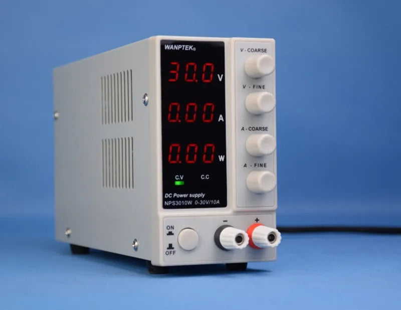 White adjustable benchtop DC power supply unit with digital displays for voltage and current.