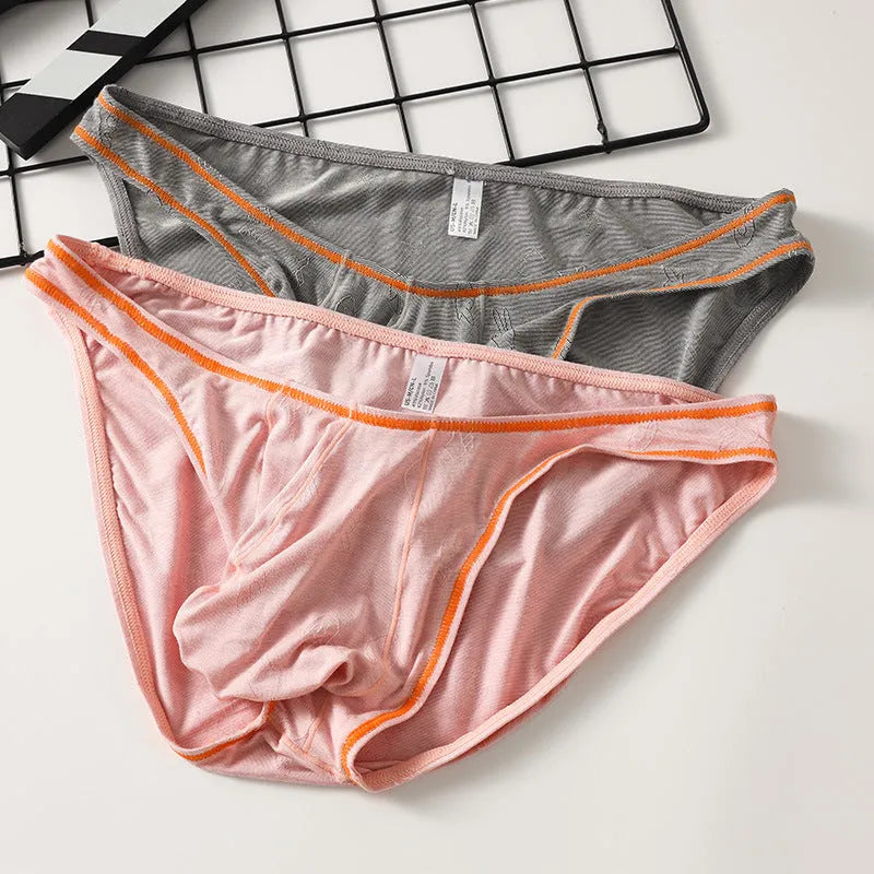 Men's modal fabric underwear with butt-lift design in dark grey, shown flat.