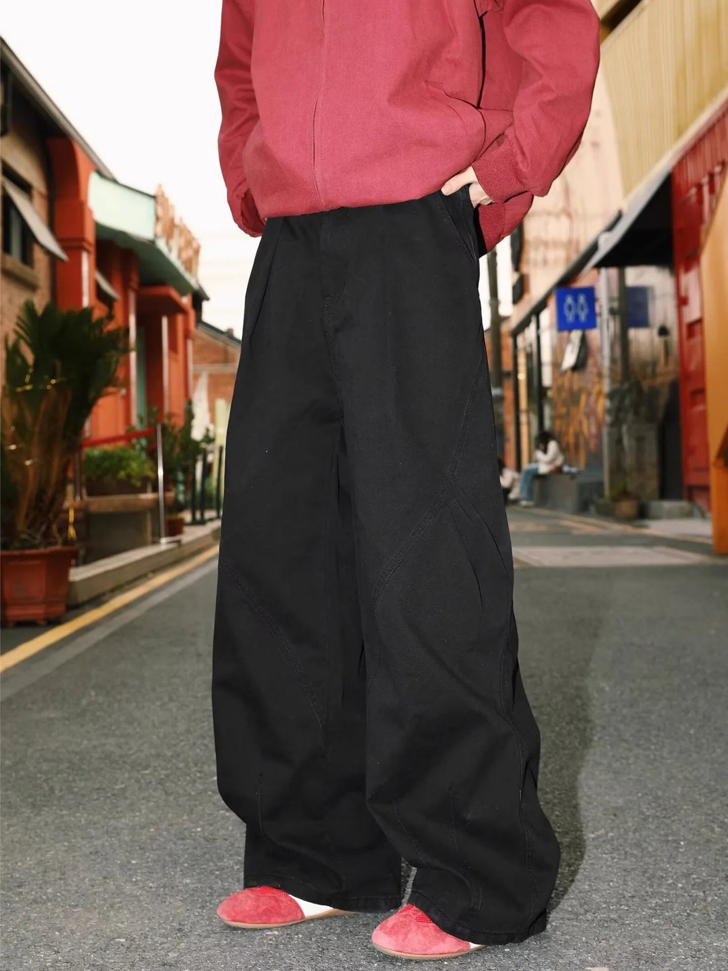 Men's straight-cut cotton trousers in black, brown, and apricot colours with striped pattern and pleated detailing