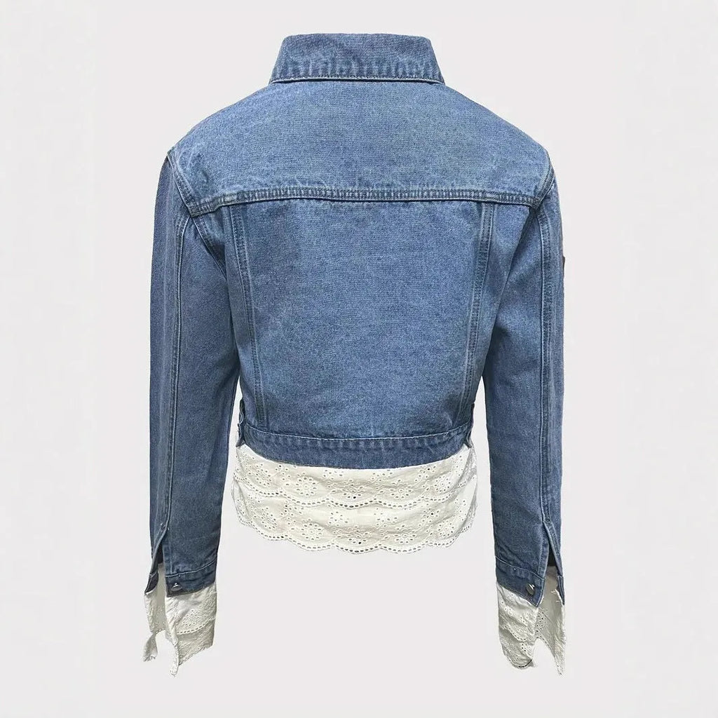 Blue women's denim jacket with lace stitching trim on long sleeves