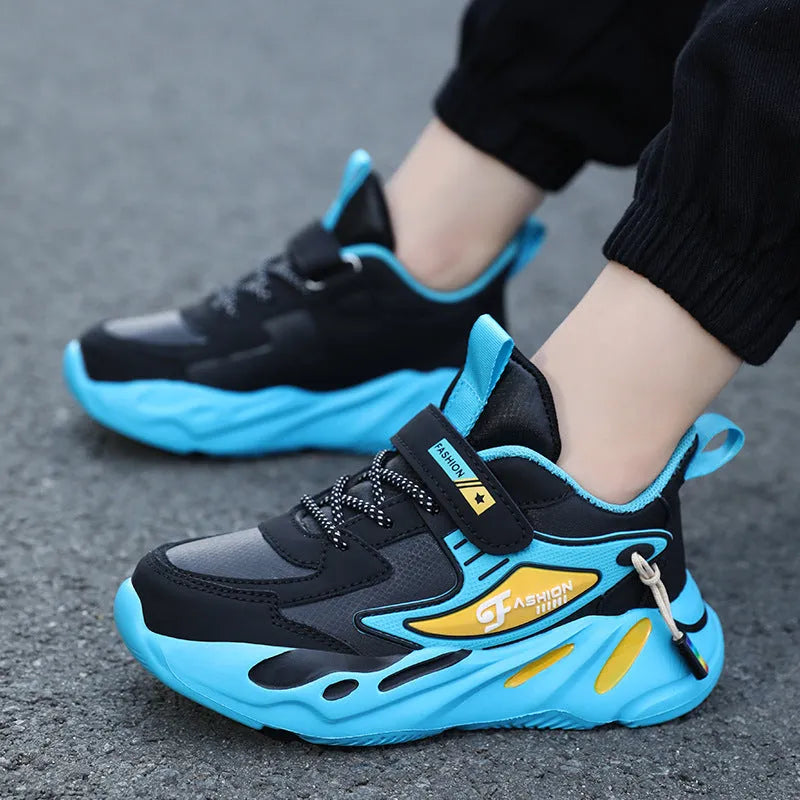 Boys dark blue and beige sports running shoes with Velcro strap and mesh upper.