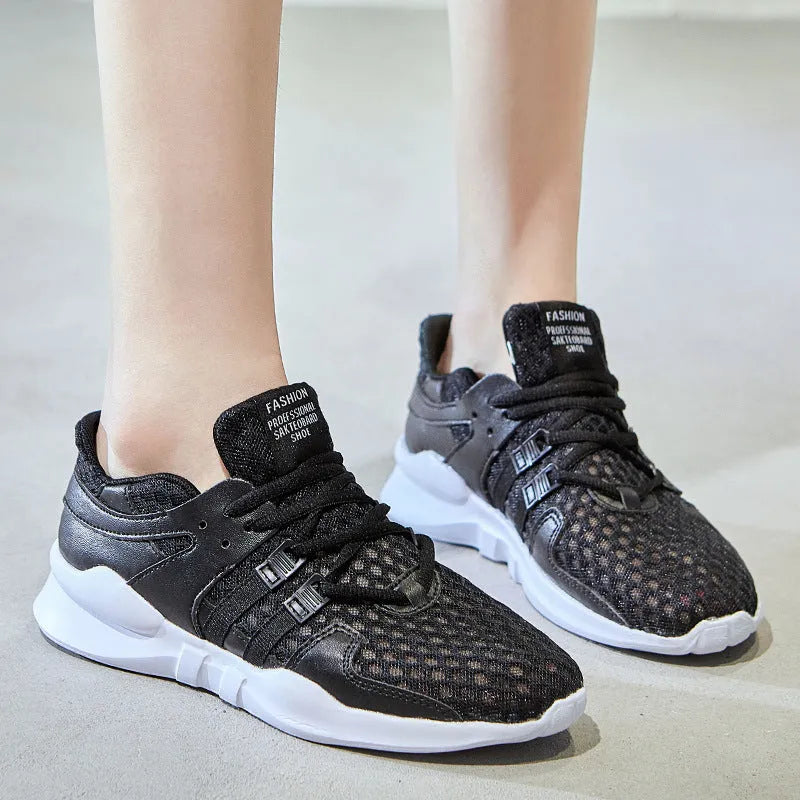 Breathable hollow-out mesh sneakers in black on a white background.