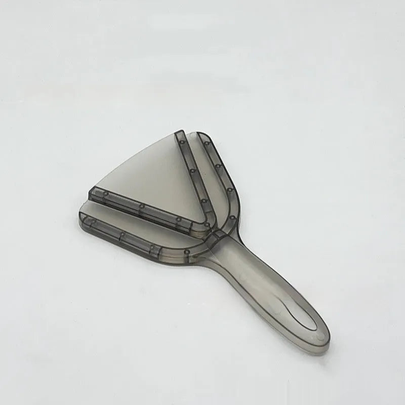 Red telescopic bottle opener with non-slip jaws, shown extended on a kitchen counter.
