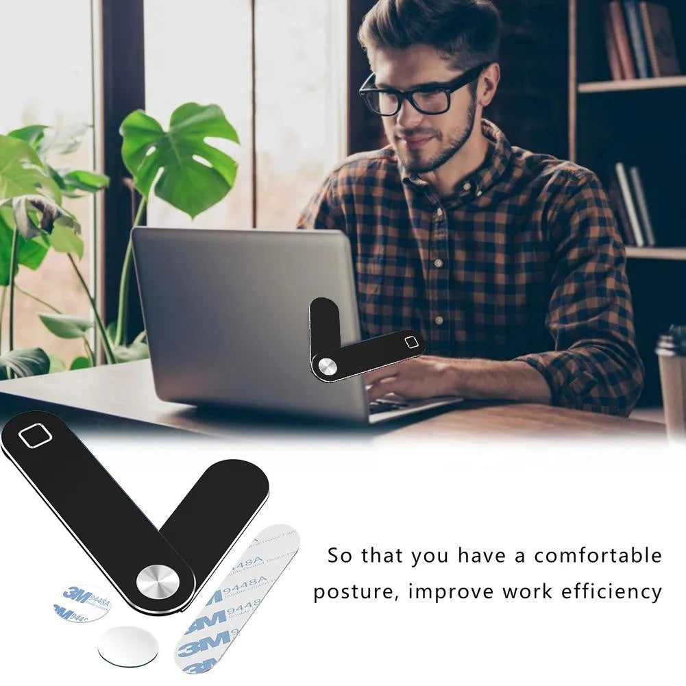 Black aluminium laptop phone holder with magnetic mount attached to a laptop screen.