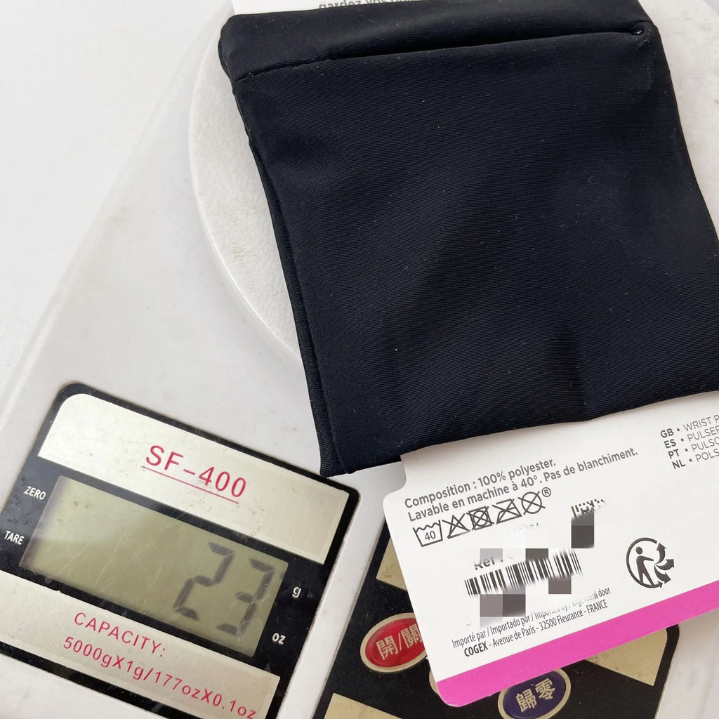Black wrist bag armband sleeve for mobile phone, shown on an arm, dimensions 10cm by 10.5cm.