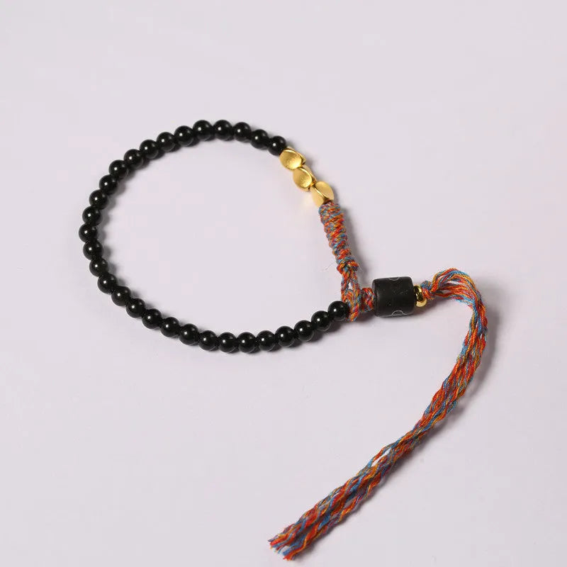 Hand-woven obsidian carrying strap showing 4mm width and textured surface