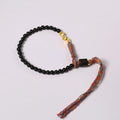 Hand-woven obsidian carrying strap showing 4mm width and textured surface