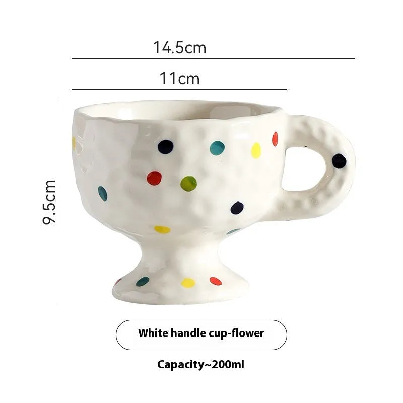 Hand-pinched irregular ceramic mug in a solid colour, shown from the side.