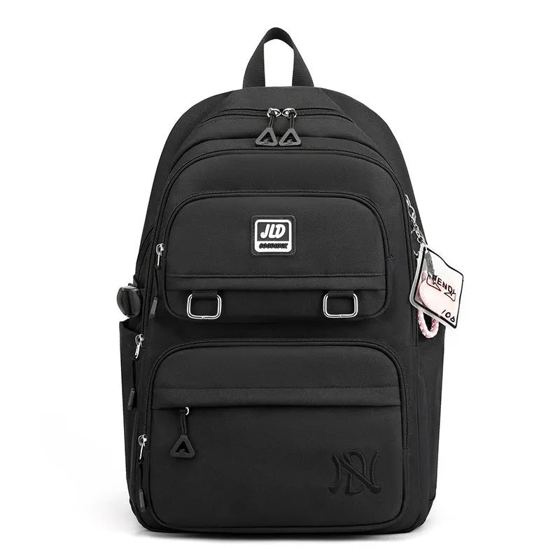 Purple girls' large capacity nylon backpack with a physiological curve backplate for school use.