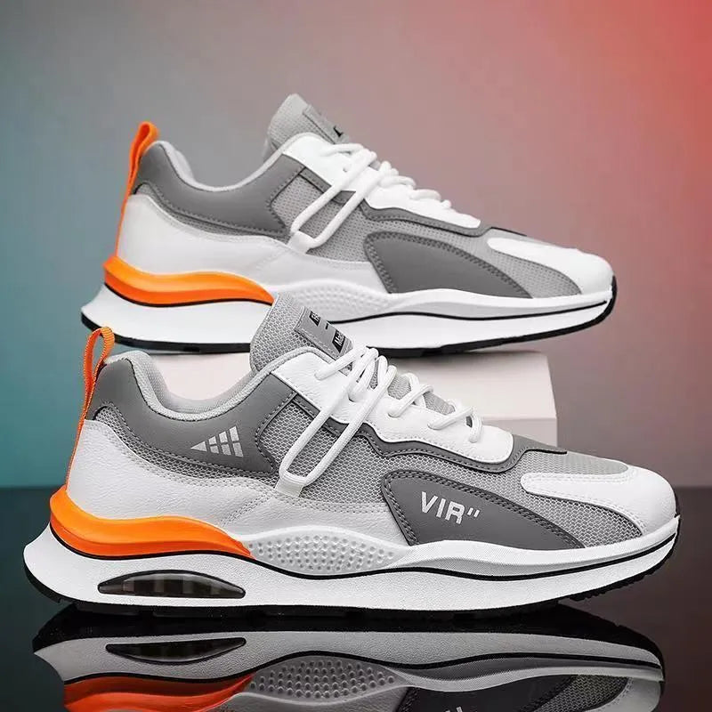 Men's grey and black mesh running shoes with round toe and mid-top design on white background