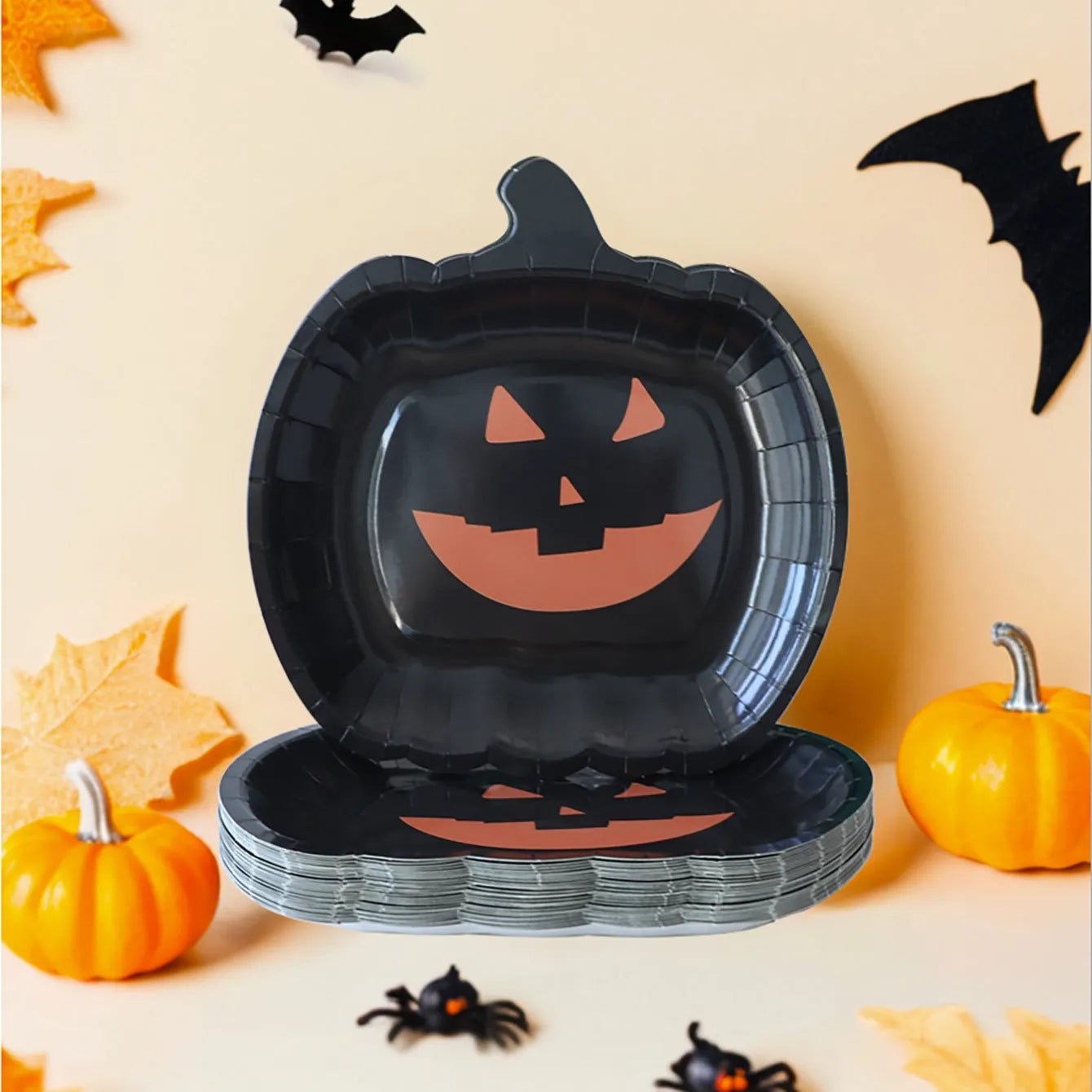 Black Halloween disposable paper plates with pumpkin design in 9-inch size