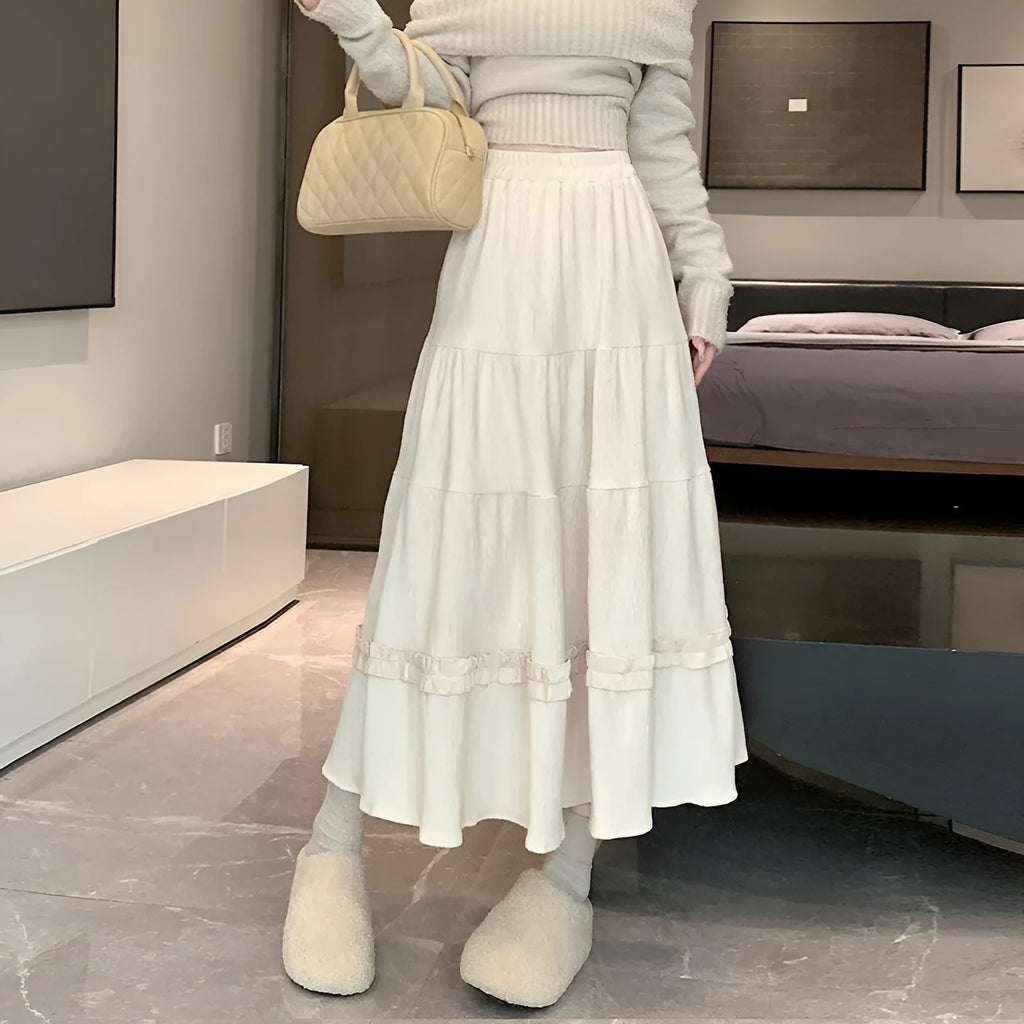 Korean-style beige corduroy A-line midi skirt with an elasticated waistband on a hanger.