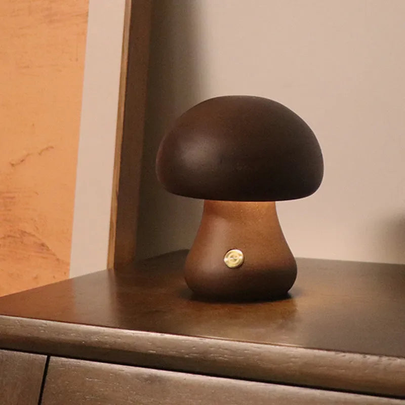 Wooden mushroom LED night light with touch switch in walnut finish on a bedside table