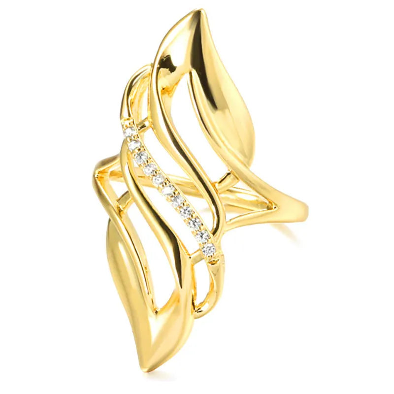 Gold copper women's ring with exaggerated curve silhouette and zircon sparkle on finger