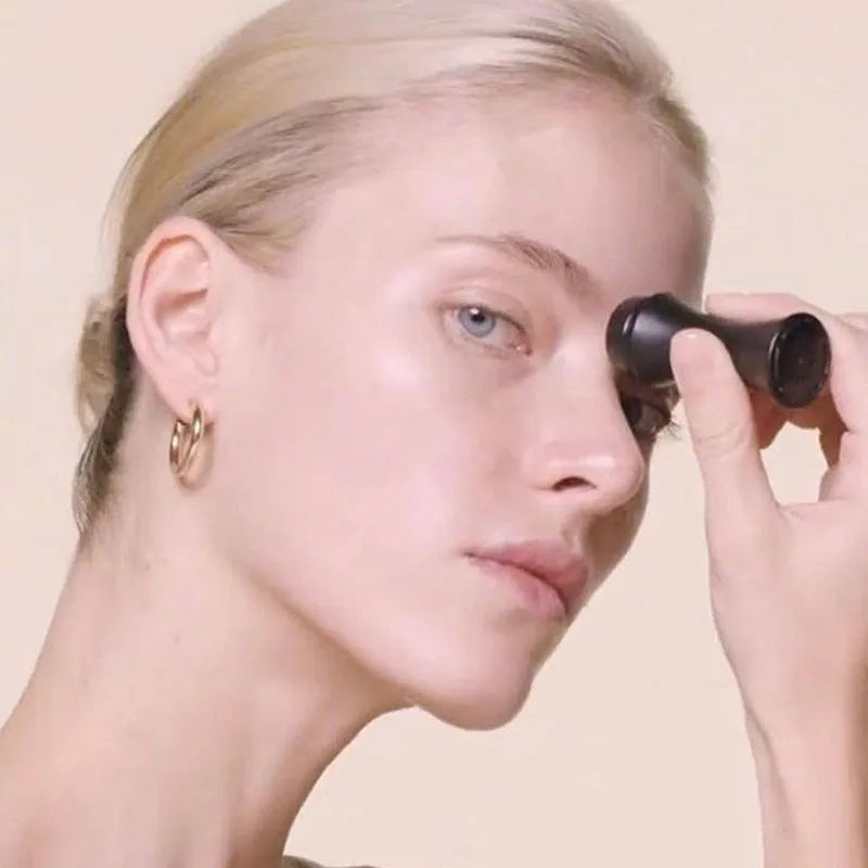 Portable volcanic stone roller for absorbing facial oil, shown in black, green, pink, and white colour options.