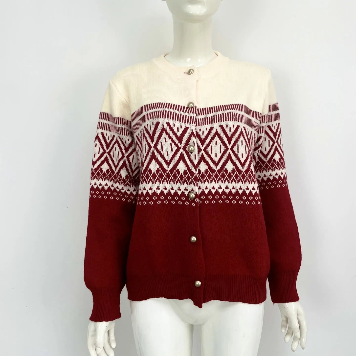 Women's alpaca wool cardigan with contrast colour diamond pattern showing long sleeves and street fashion styling