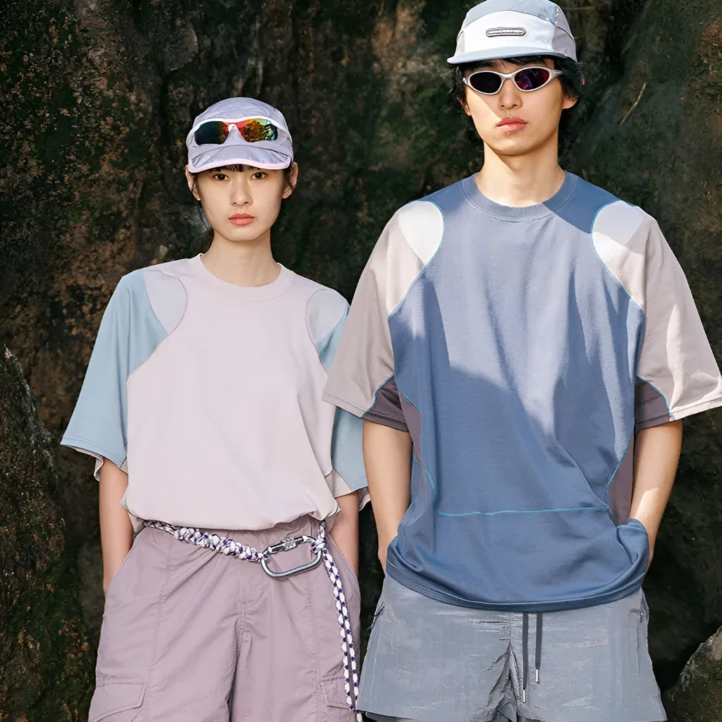 Men's loose blue patchwork short sleeve t-shirt on a hanger.