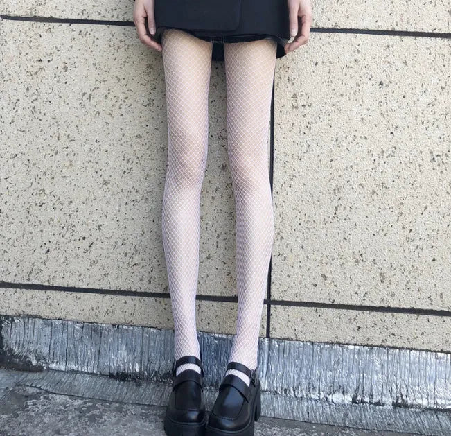 Women's mesh stockings in large, medium, and small hole patterns in black and white colours.