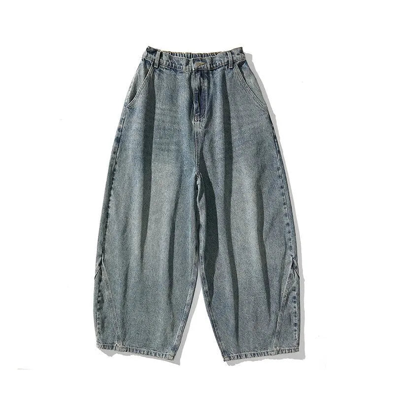 Men's plus size baggy jeans in light blue denim with wide straight legs and a low waist.