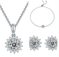 925 silver three piece jewellery set with moissanite pendant, stud earrings, and bracelet on white background