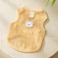 Cat wearing breathable hollowed-out knitted clothing with cartoon bear patch in blue colour