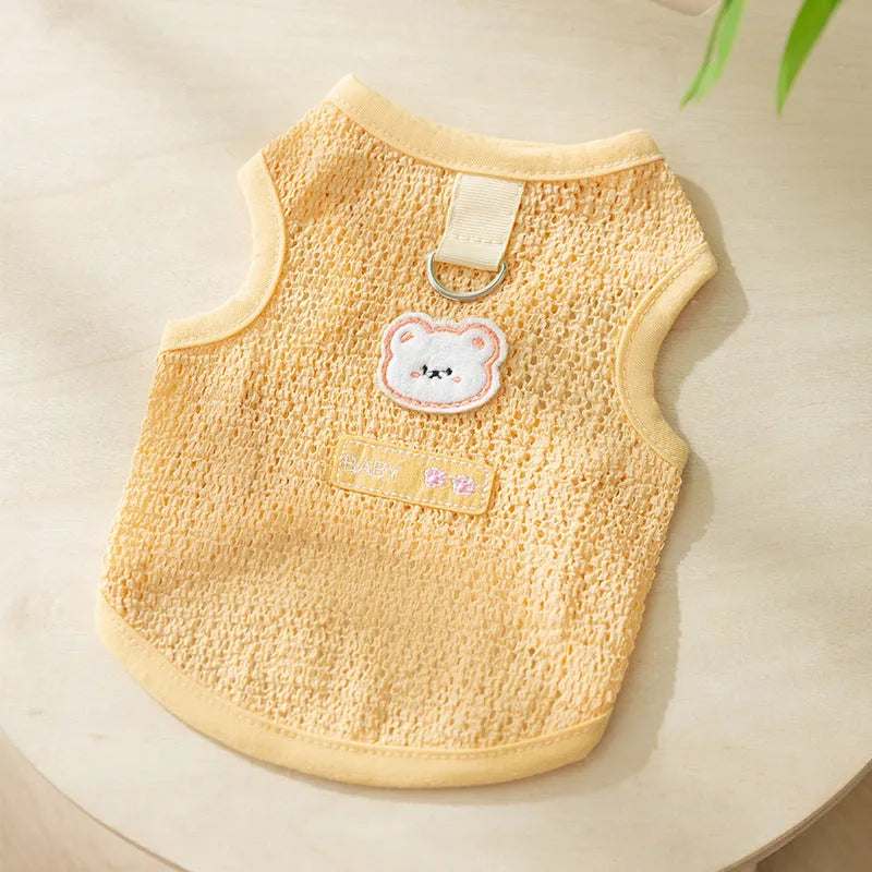 Cat wearing breathable hollowed-out knitted clothing with cartoon bear patch in blue colour