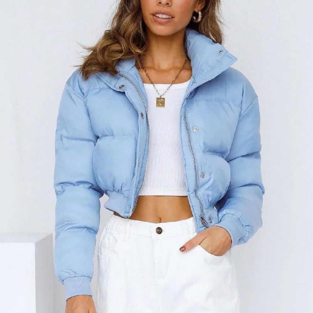 Women's loose fit long sleeve polyester jacket in blue, shown on a hanger.