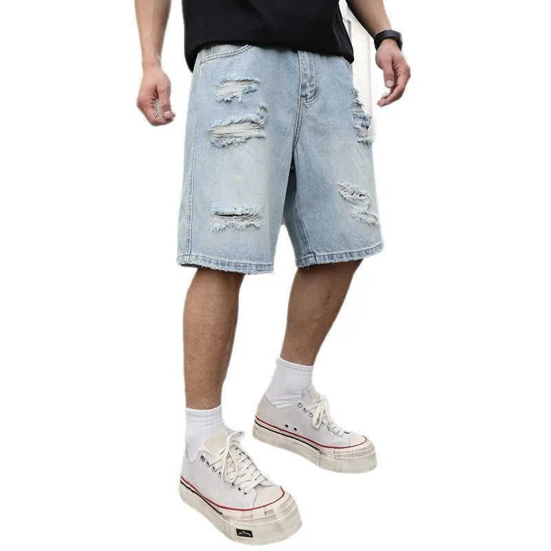Light blue distressed denim shorts with straight leg cut and hip hop style on hanger