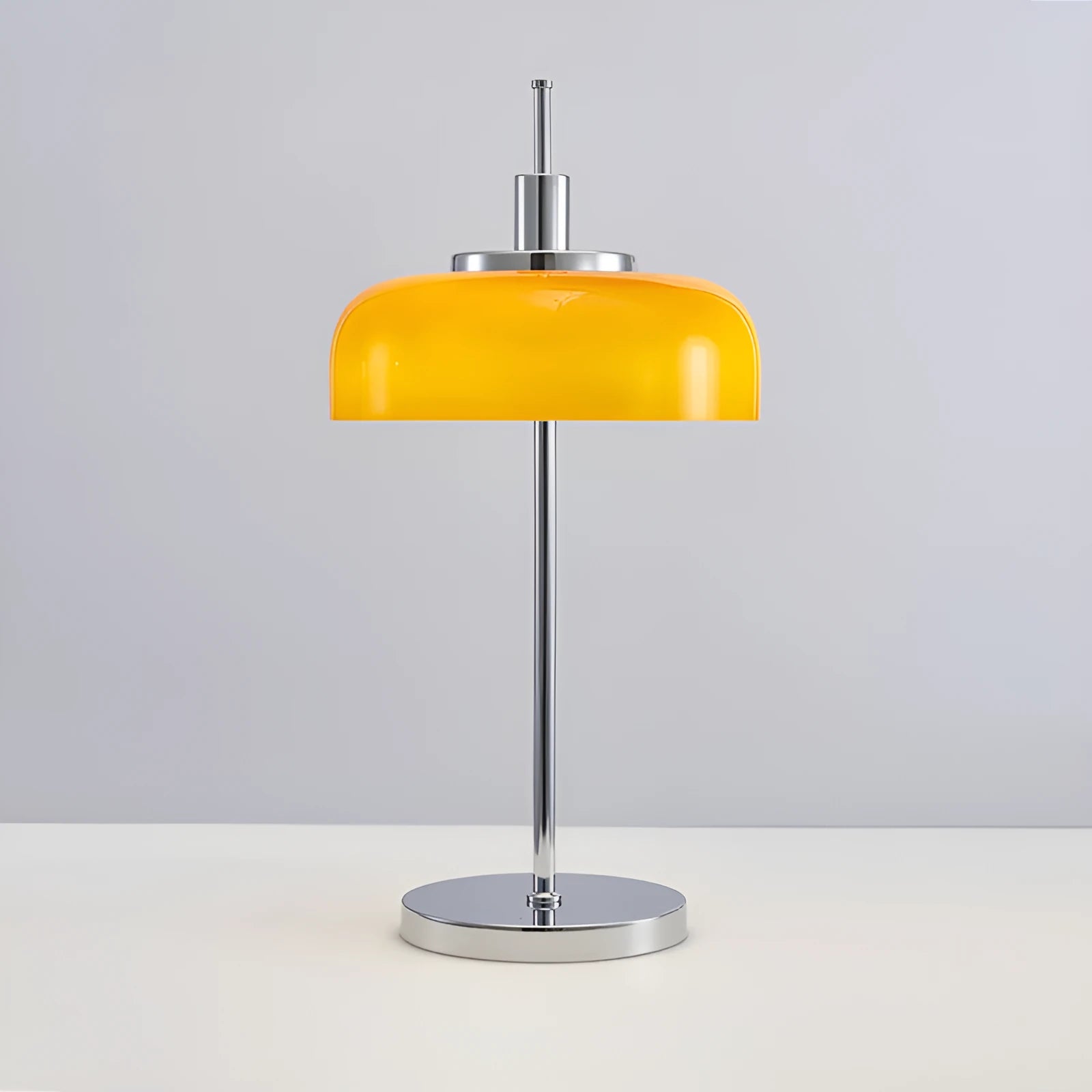 Retro table lamp with glass lampshade and chrome finish on a wooden surface