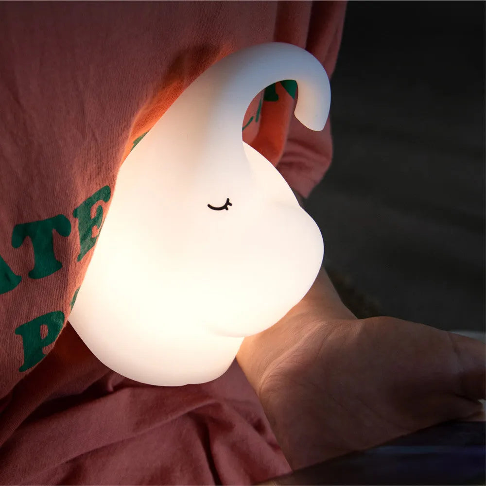 DOMI Elephant silicone night light with soft white glow on bedside table