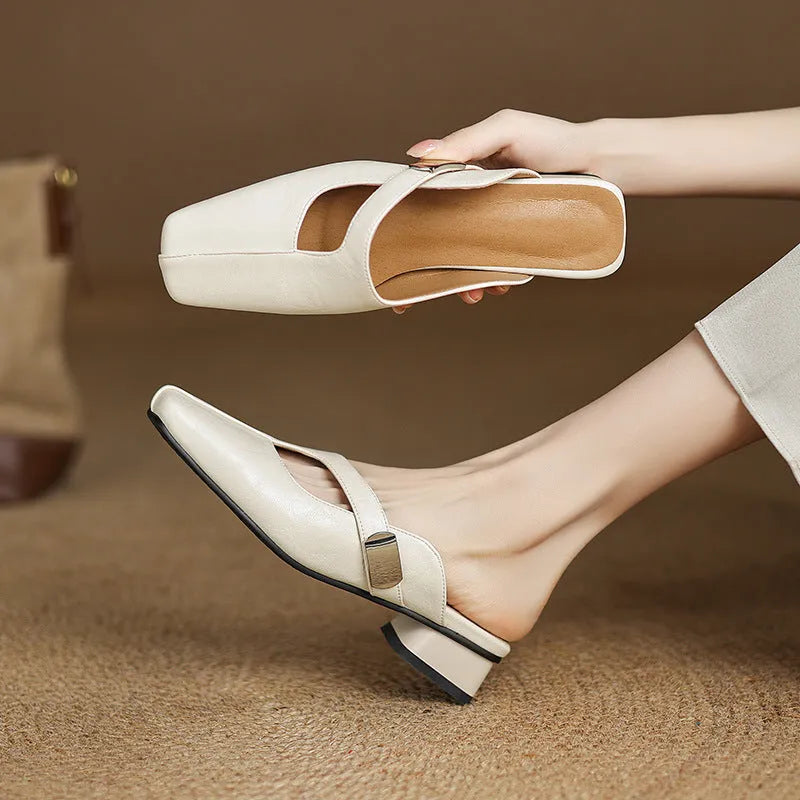 British style square head outdoor slippers in black, beige and silver colours with a low heel and rubber sole.