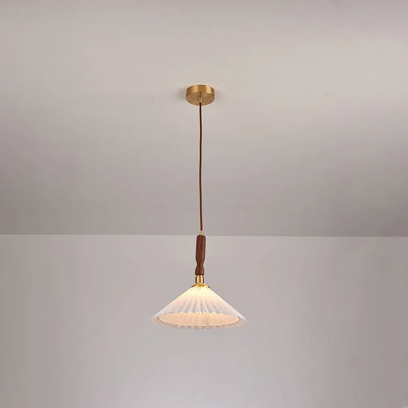 American retro walnut wood wall lamp with fabric shade on a wooden bedside table