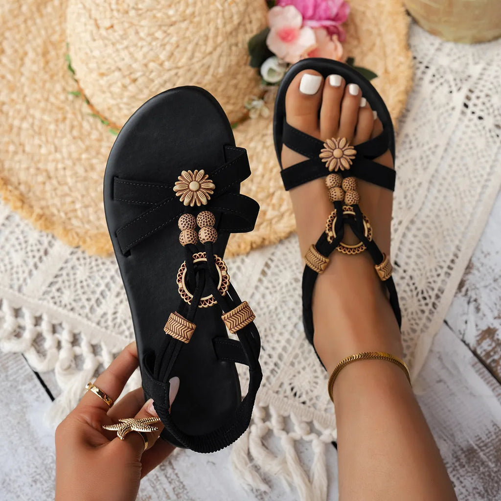 Black women's ethnic style flat sandals with beaded weave pattern and open toe design