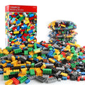 1000 red ABS plastic granular building blocks in a bulk box for creative construction play