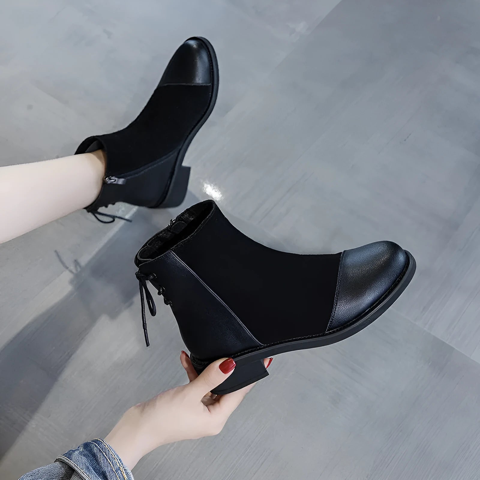 Black women's Martin boots with side zip, round toe, and knee-length shaft