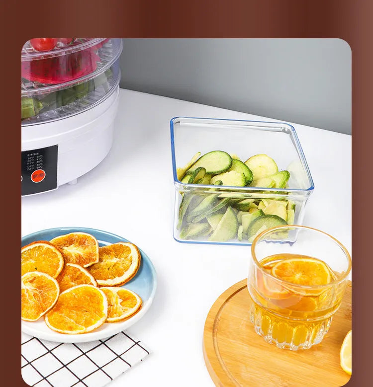 Household food dehydrator appliance with multiple stacked drying shelves on a countertop