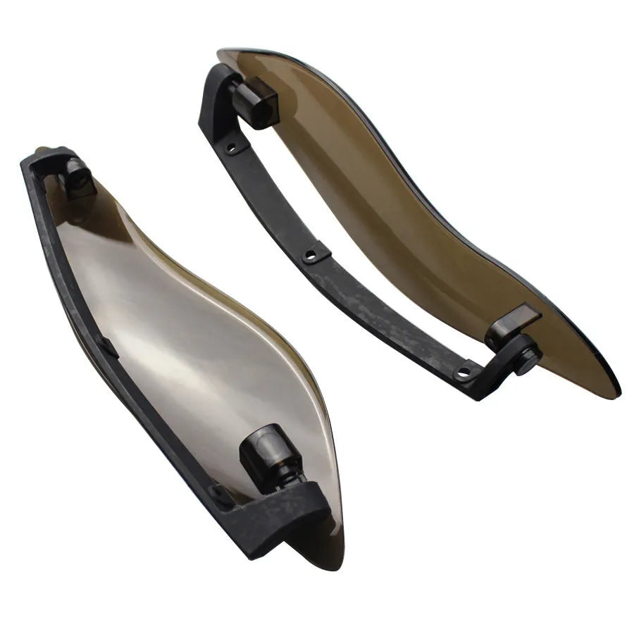 Pair of smoked ABS plastic motorcycle side wing panels for Harley trike models.