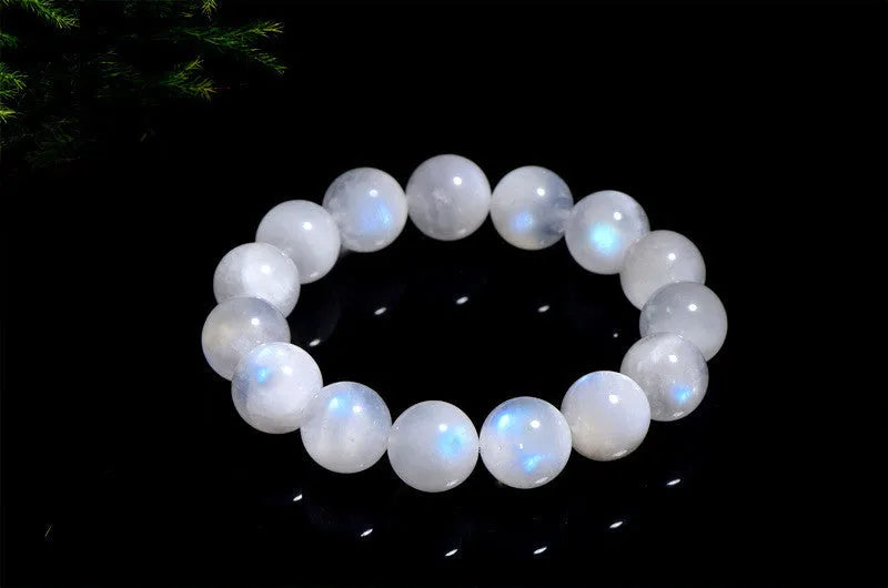 Natural blue moonlight round bead moonstone bracelet showing polished gemstone beads on wrist