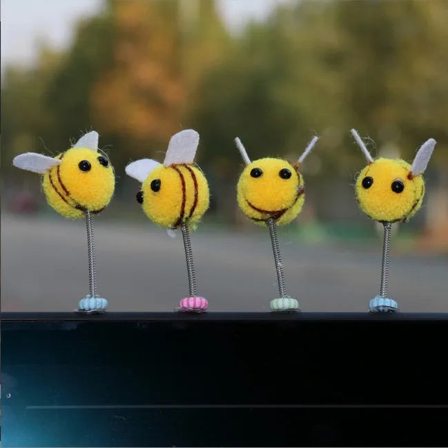 Cartoon-style little bee car decoration made from a soft fur ball, shown next to a ruler showing its 3cm size.