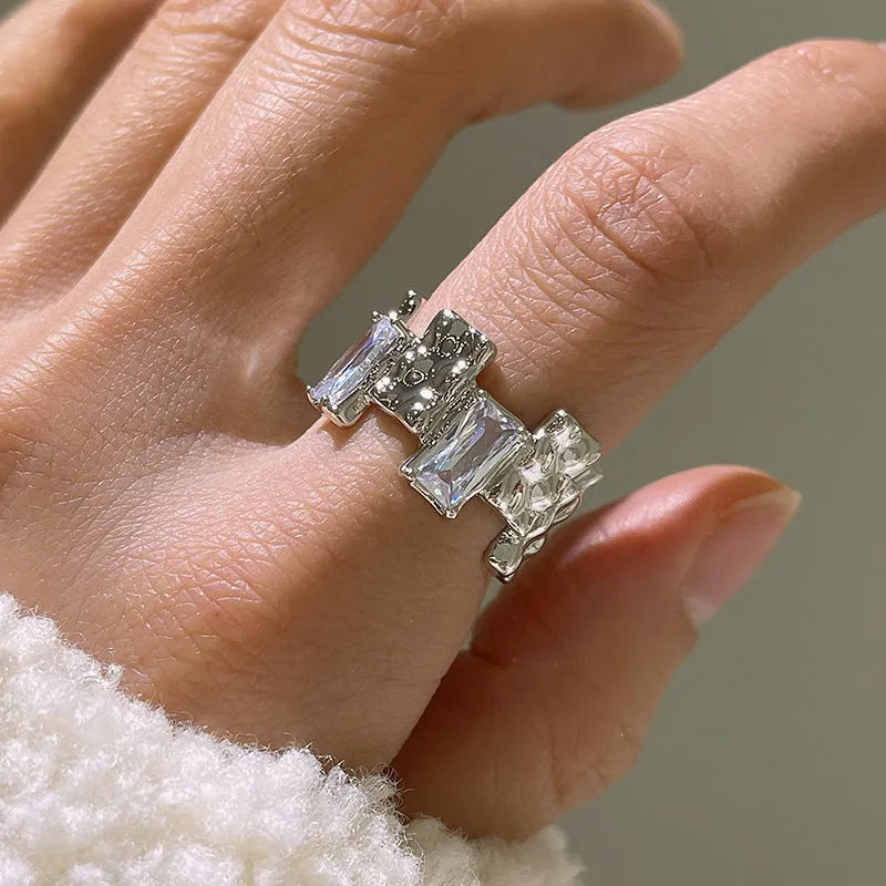 Silver geometric cross ring with zircon detailing and open pastoral retro design