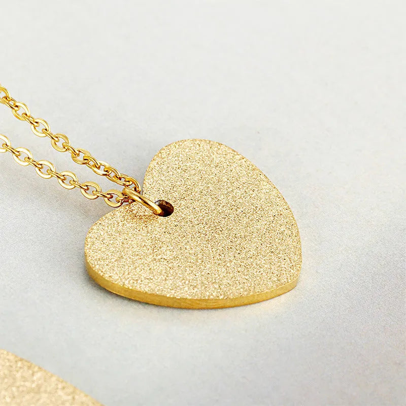 Geometric heart-shaped titanium steel pendant necklace on model