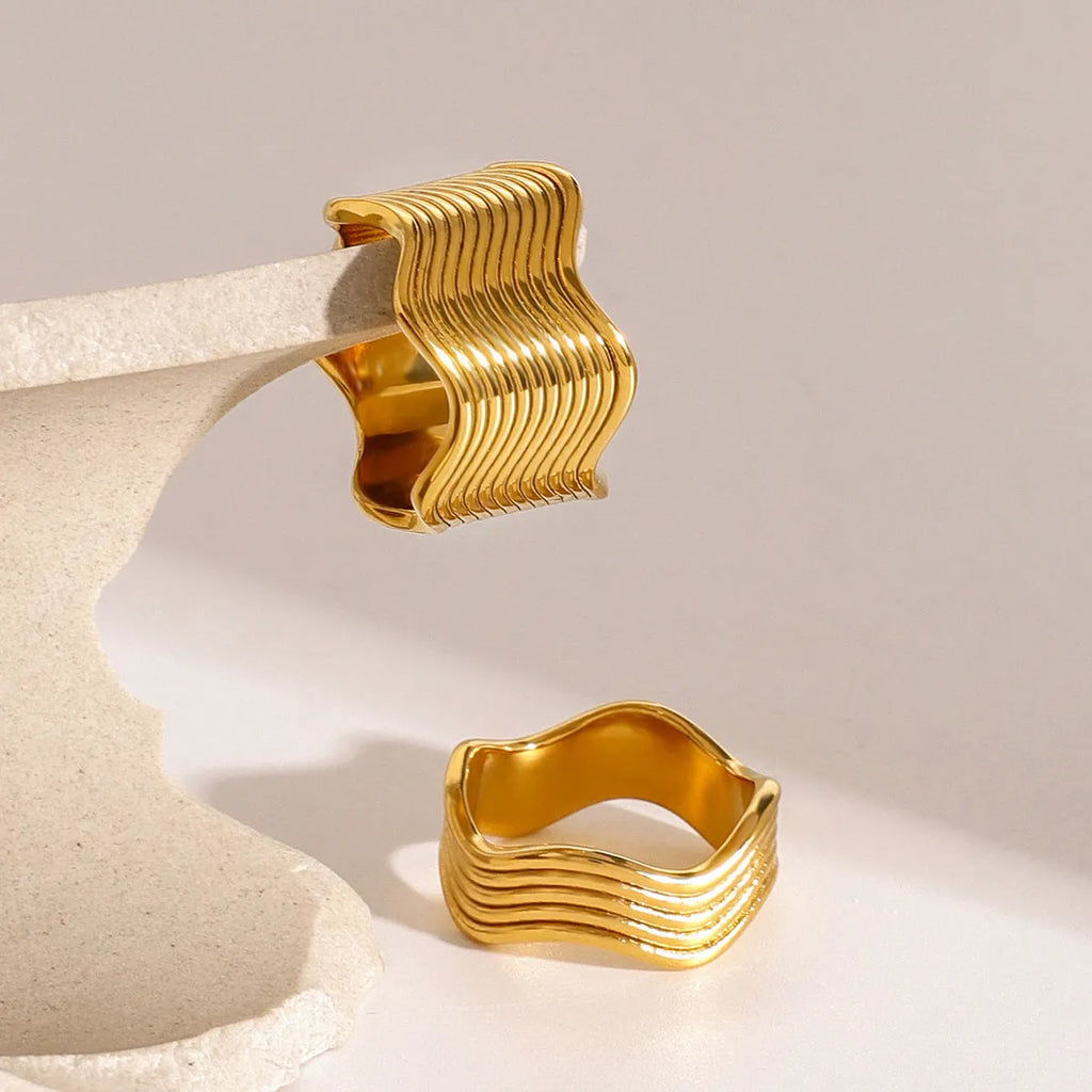 Stainless steel geometric wave pattern ring with wide band and electroplated finish